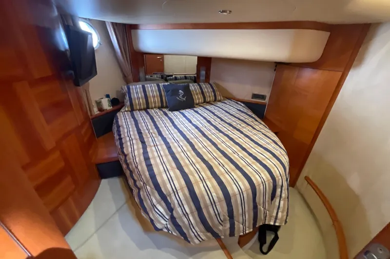  Yacht Photos Pics Luxurious cabin interior of 2005 Azimut Fly 50 yacht with striped bedding.