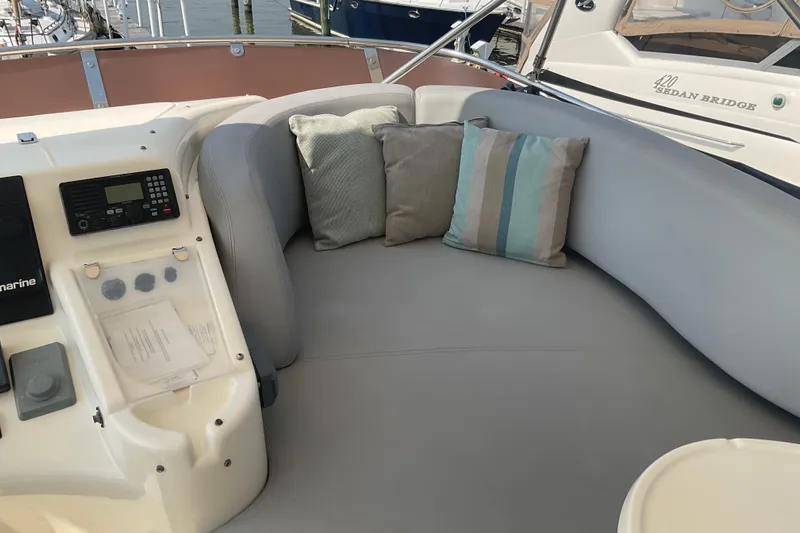  Yacht Photos Pics Luxurious seating area on 2005 Azimut Fly 50 yacht with cushions and control panel.