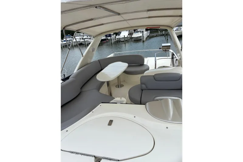  Yacht Photos Pics Luxurious 2005 Azimut Fly 50 yacht interior with elegant seating and table.