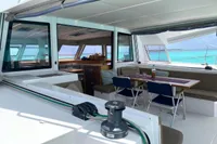 Nautitech 46 Open 2018 catamaran interior with dining area and ocean view.