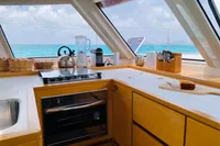 Modern kitchen interior of 2018 Nautitech 46 Open catamaran with ocean view.