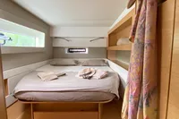 Cozy bedroom in 2018 Nautitech 46 Open yacht with natural light and stylish decor.