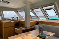 Interior of 2018 Nautitech 46 Open catamaran with kitchen and seating area, ocean view.