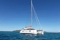 2018 Nautitech 46 Open catamaran sailing on clear blue ocean waters.