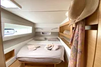 Cozy bedroom in 2018 Nautitech 46 Open catamaran with stylish decor and natural light.