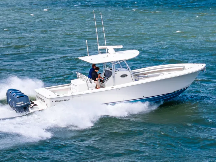 Dauntless Yacht Photos Pics 2018 Regulator 34 FS boat cruising on open water with twin Yamaha engines.