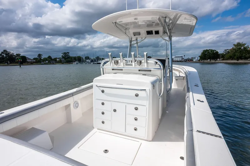 Dauntless Yacht Photos Pics 2018 Regulator 34 FS boat on calm water, featuring spacious deck and storage.