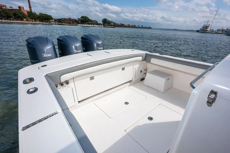 Dauntless Yacht Photos Pics 2018 Regulator 34 FS boat with triple 300 horsepower engines on calm water.