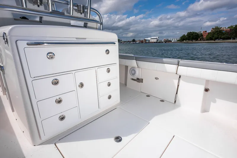 Dauntless Yacht Photos Pics 2018 Regulator 34 FS boat interior with storage compartments, on a sunny day by the water.