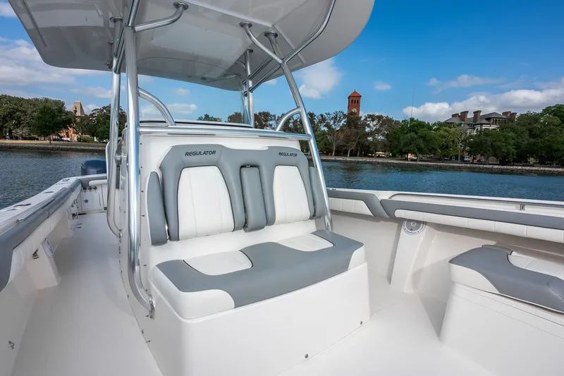 Dauntless Yacht Photos Pics 2018 Regulator 34 FS boat interior with seating, on a calm waterway.