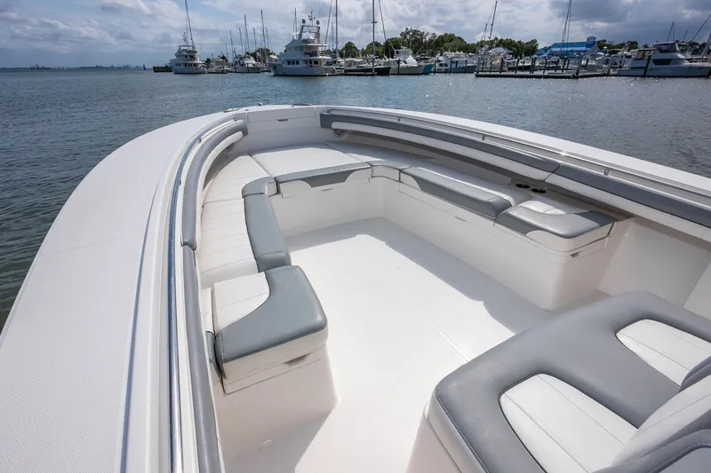 Dauntless Yacht Photos Pics 2018 Regulator 34 FS boat with spacious seating, docked at a marina.