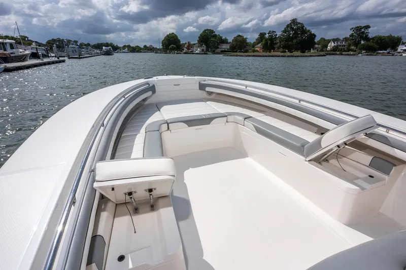 Dauntless Yacht Photos Pics 2018 Regulator 34 FS boat with spacious seating on a calm waterway.