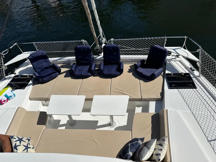 Encore Yacht Photos Pics Luxurious Bali 4.1 catamaran deck with cushioned seating and tables, 2020 model.