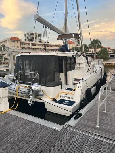Encore Yacht Photos Pics Bali 4.1 catamaran docked at marina, 2020 model, with scenic background.