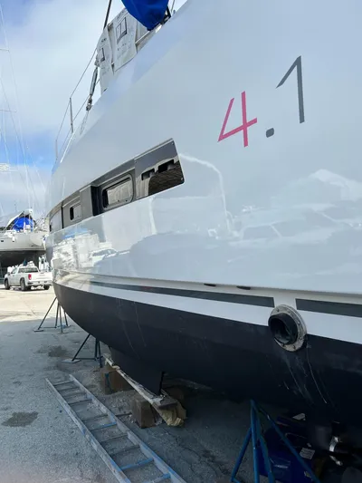 Encore Yacht Photos Pics Bali 4.1 catamaran from 2020 on dry dock, showcasing sleek design and hull details.