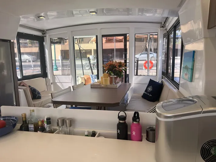 Encore Yacht Photos Pics Modern Bali 4.1 yacht interior with dining area, kitchen, and panoramic windows, 2020 model.