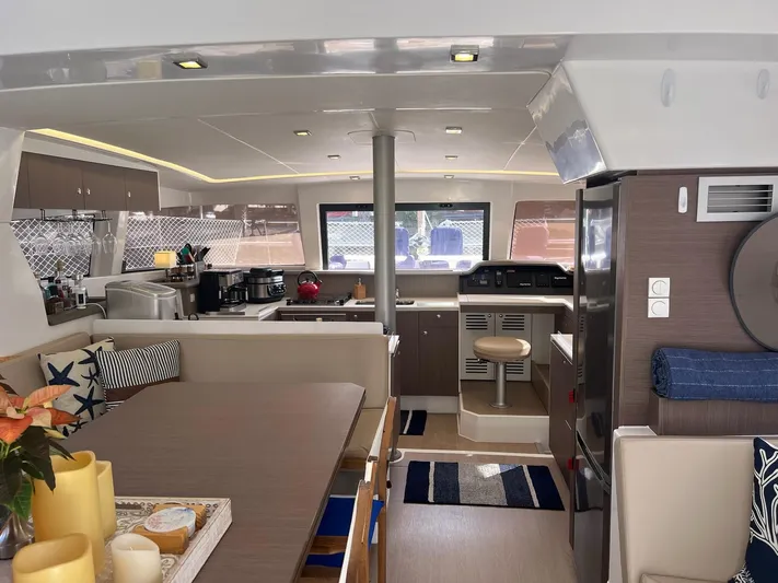 Encore Yacht Photos Pics Modern interior of a 2020 Bali 4.1 catamaran with kitchen and dining area.
