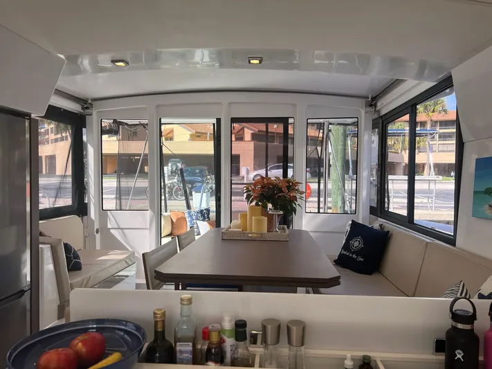 Encore Yacht Photos Pics Interior of 2020 Bali 4.1 catamaran with dining area and large windows.