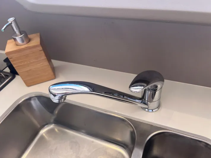 Encore Yacht Photos Pics Modern kitchen sink with chrome faucet and wooden soap dispenser, Bali 4.1 model, 2020.