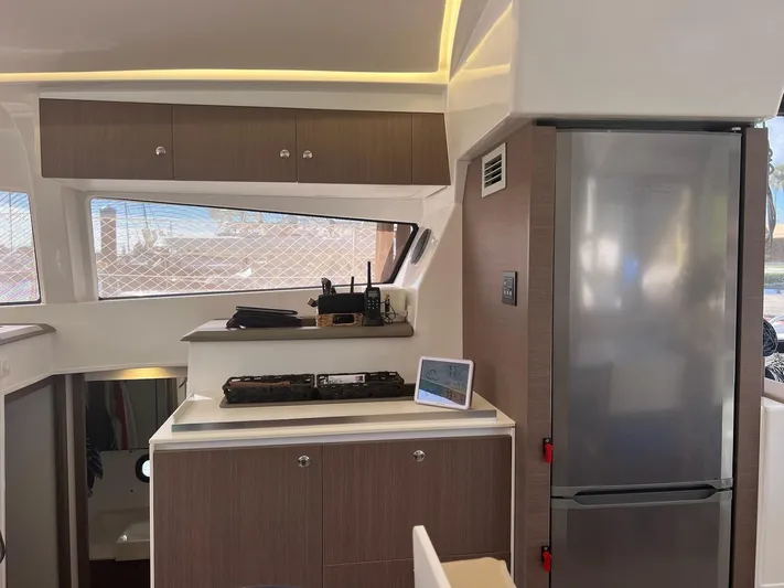 Encore Yacht Photos Pics Modern kitchen interior of 2020 Bali 4.1 yacht with fridge and stove.