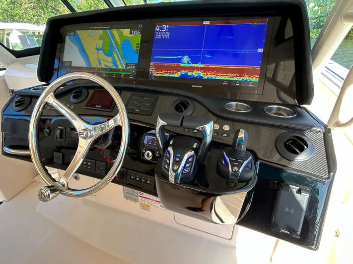  Yacht Photos Pics 2024 Grady-White Canyon 456 helm with advanced navigation displays and controls.