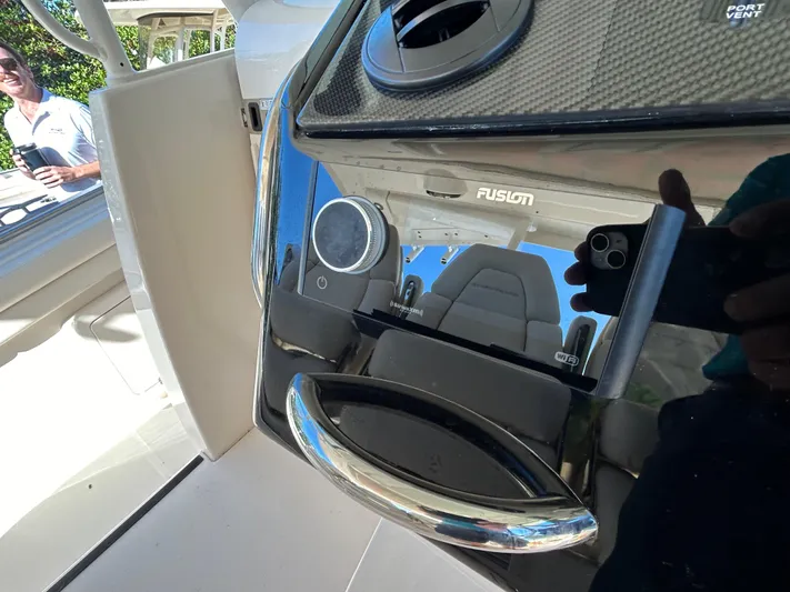  Yacht Photos Pics 2024 Grady-White Canyon 456 boat dashboard with Fusion audio system.