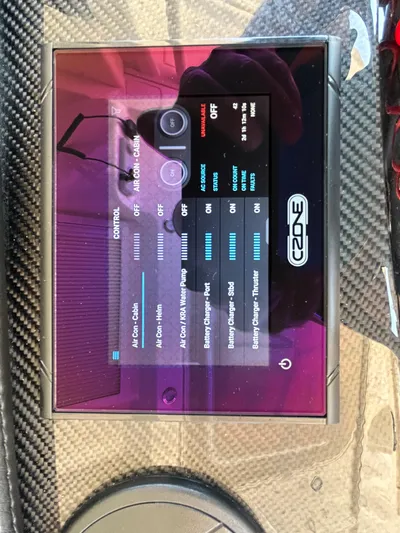  Yacht Photos Pics Touchscreen control panel on 2024 Grady-White Canyon 456 boat, displaying various system settings.