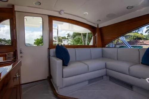 Caballo Grande Yacht Photos Pics Luxurious interior of 2024 Viking Convertible EB yacht with plush seating and elegant wood finishes.