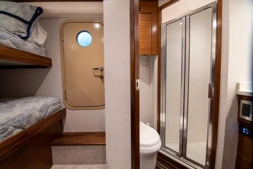 Caballo Grande Yacht Photos Pics 2024 Viking Convertible EB interior with bunk beds and bathroom.