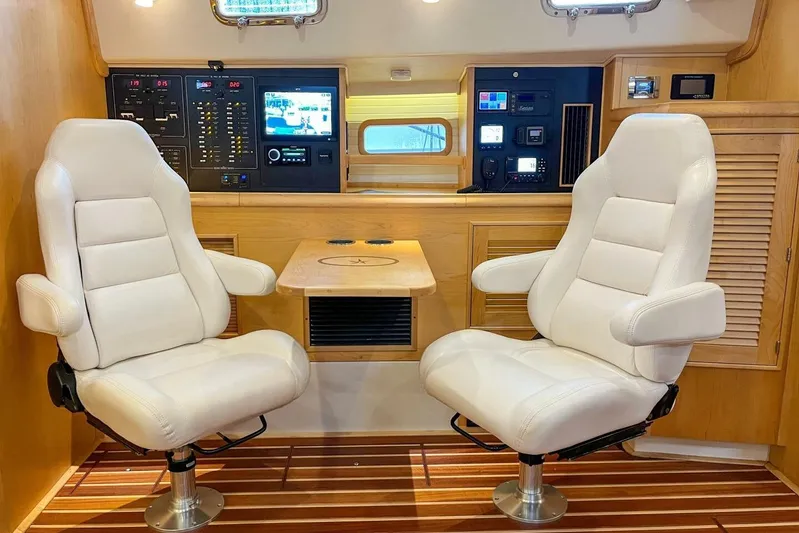  Yacht Photos Pics Luxurious interior of 2023 Island Packet 439 yacht with plush seating and advanced control panels.