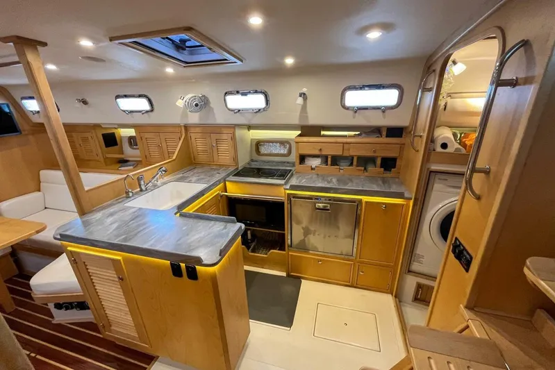  Yacht Photos Pics Luxurious 2023 Island Packet 439 yacht interior with modern kitchen and cozy seating area.