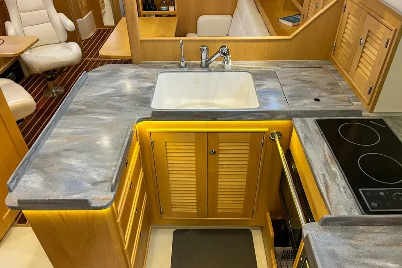  Yacht Photos Pics Luxurious 2023 Island Packet 439 yacht kitchen with modern sink and induction cooktop.