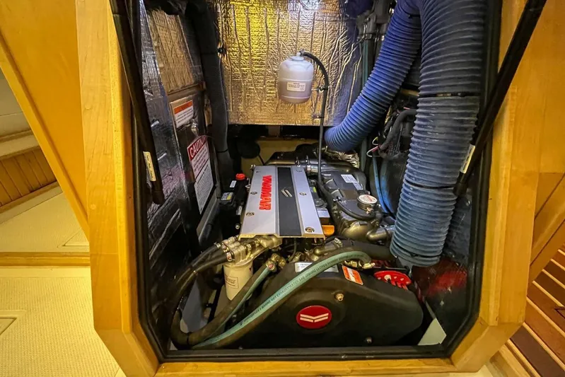  Yacht Photos Pics Engine compartment of 2023 Island Packet 439 sailboat, featuring Yanmar engine and insulated walls.