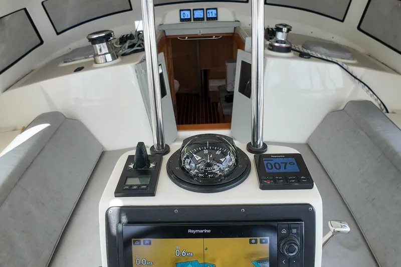  Yacht Photos Pics 2023 Island Packet 439 yacht interior with navigation instruments and compass.