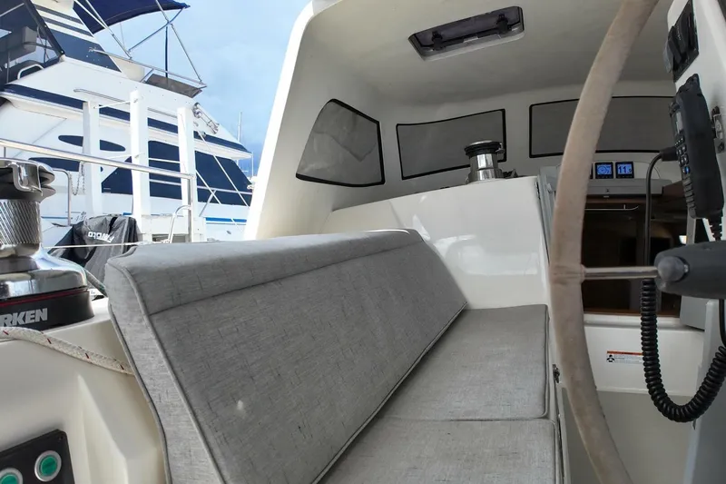  Yacht Photos Pics Interior view of 2023 Island Packet 439 sailboat cockpit with seating and navigation equipment.