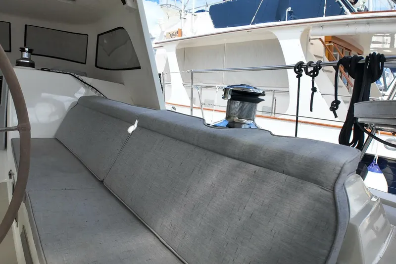  Yacht Photos Pics 2023 Island Packet 439 yacht cockpit with cushioned seating and winch.