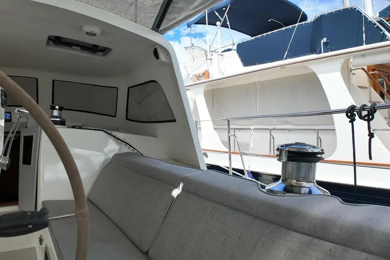  Yacht Photos Pics Interior view of 2023 Island Packet 439 sailboat cockpit with seating and winch.