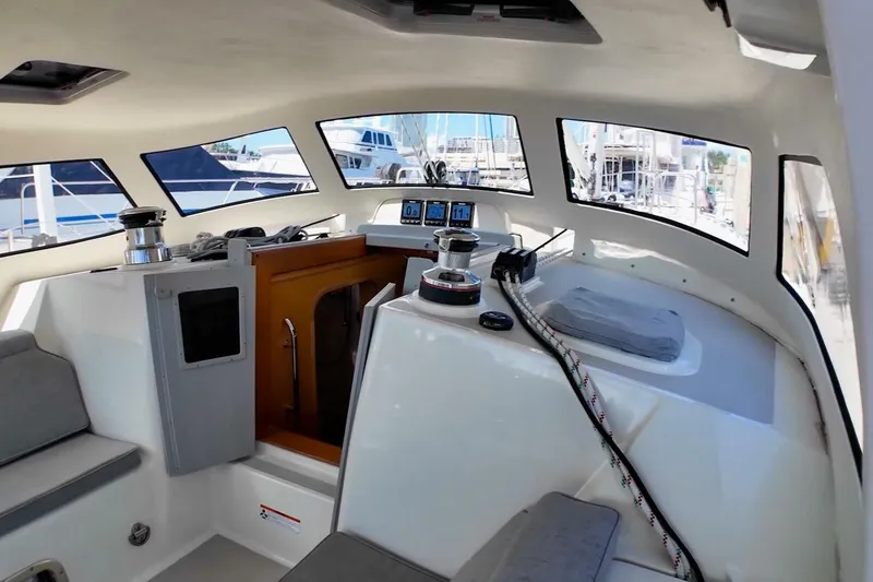  Yacht Photos Pics 2023 Island Packet 439 yacht interior with navigation equipment and seating area.