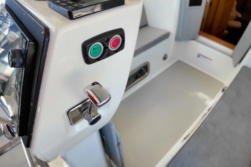  Yacht Photos Pics 2023 Island Packet 439 yacht interior with control panel and seating area.