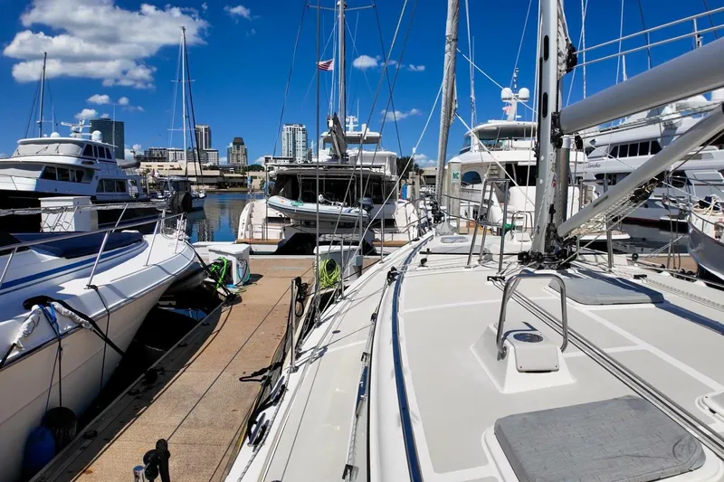  Yacht Photos Pics 2023 Island Packet 439 sailboat docked at marina with city skyline.