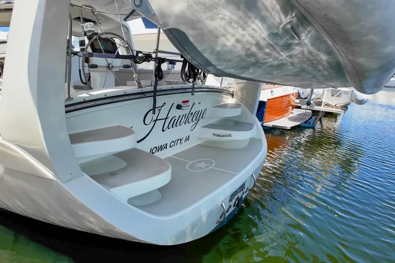  Yacht Photos Pics 2023 Island Packet 439 yacht docked, featuring elegant steps and "Hawkeye" name.