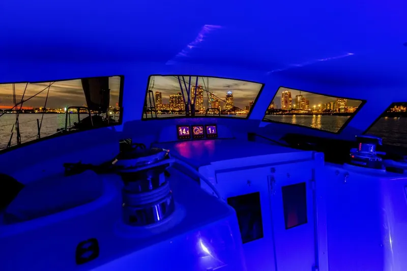  Yacht Photos Pics Interior of 2023 Island Packet 439 yacht with city skyline at night.
