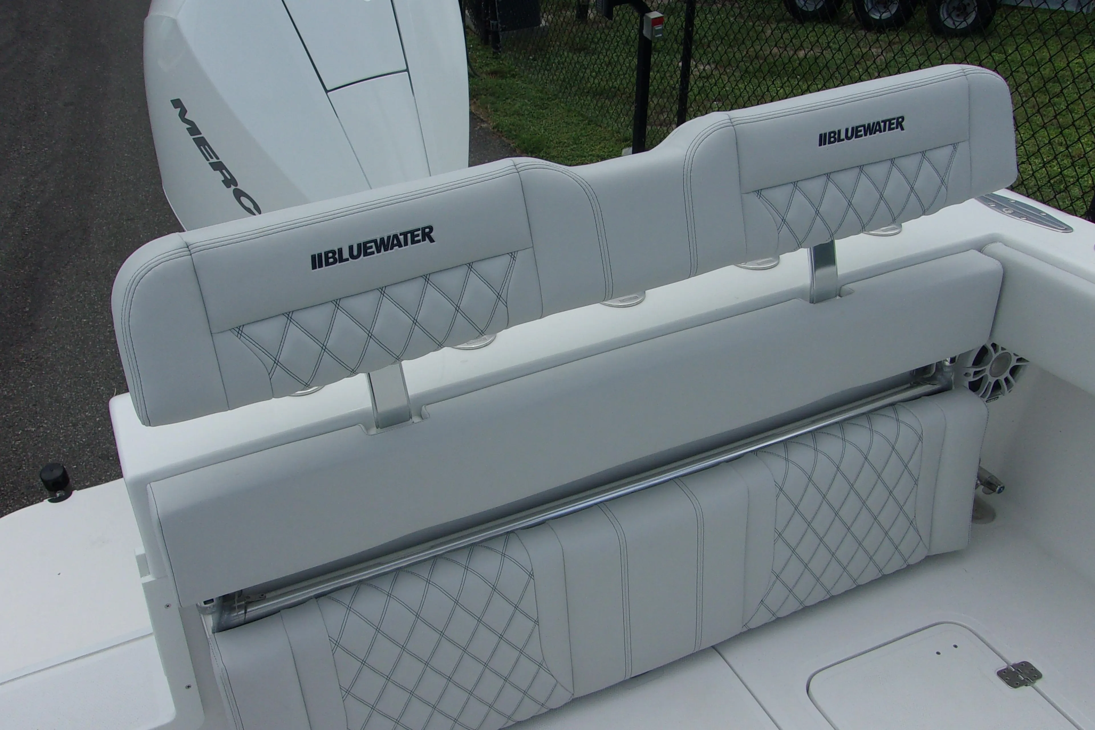 2025 Bluewater 23 T boat with white cushioned seating and diamond stitching.