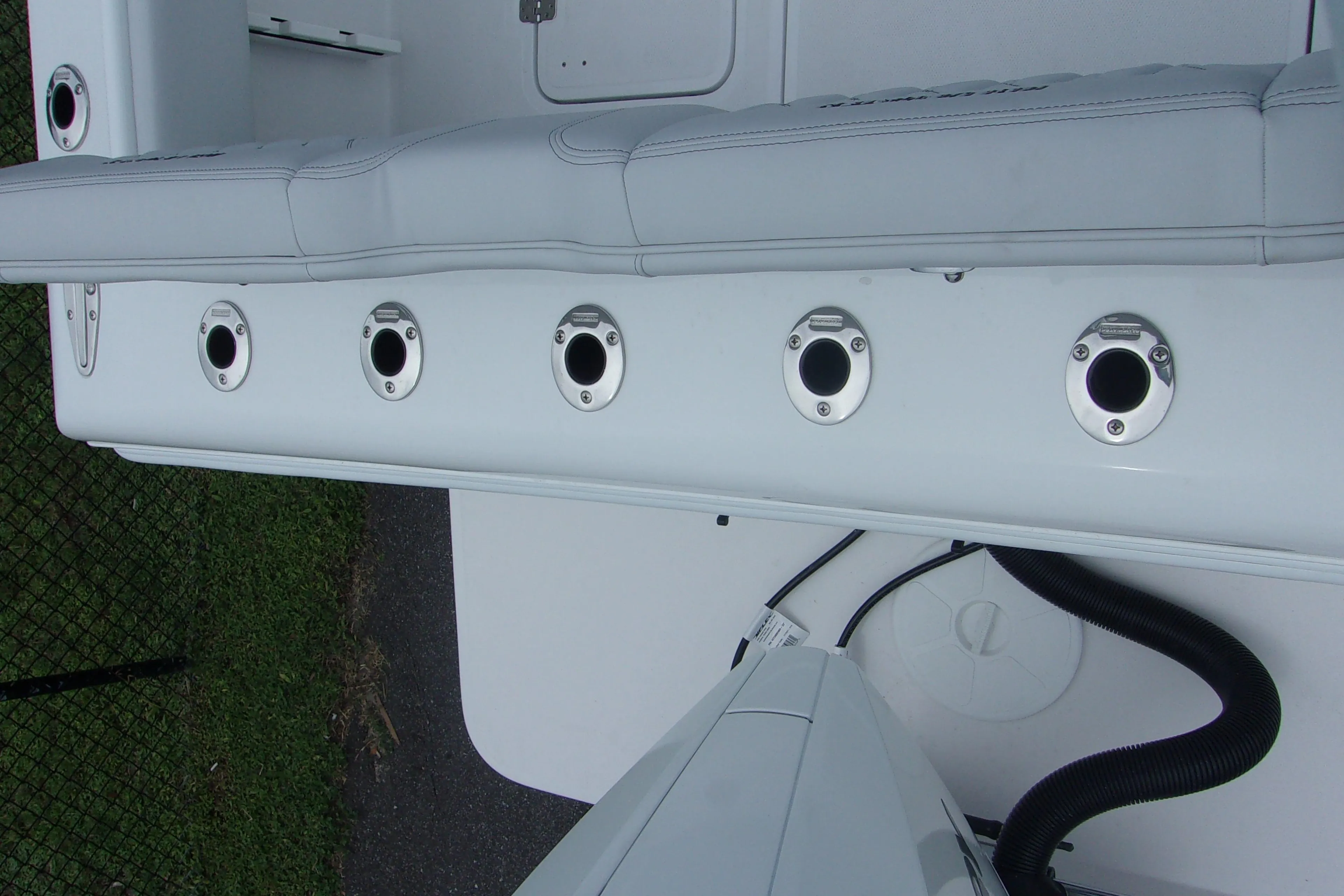 2025 Bluewater 23 T boat interior with rod holders and seating.