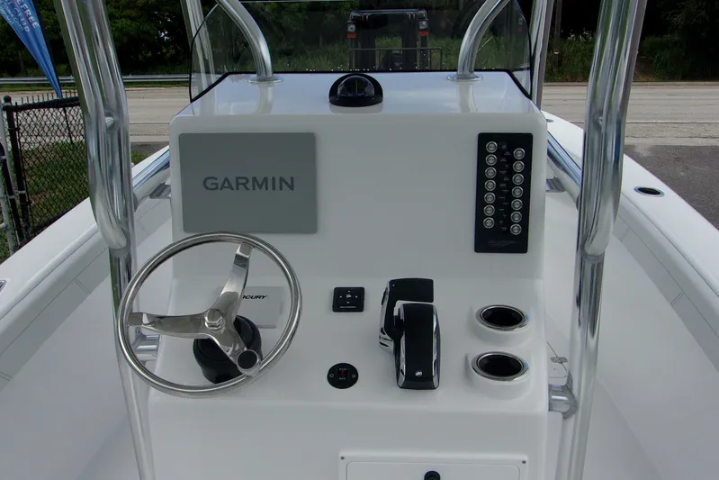  Yacht Photos Pics 2025 Bluewater 23 T boat console with Garmin navigation and steering wheel.