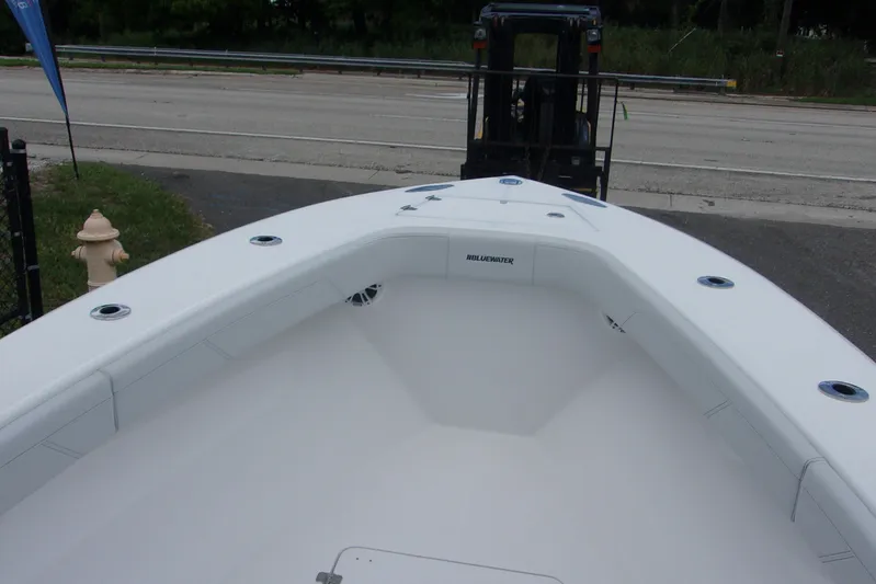  Yacht Photos Pics 2025 Bluewater 23 T boat interior with sleek white design and spacious seating.