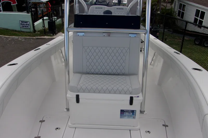  Yacht Photos Pics 2025 Bluewater 23 T boat interior with cushioned seating and cooler.