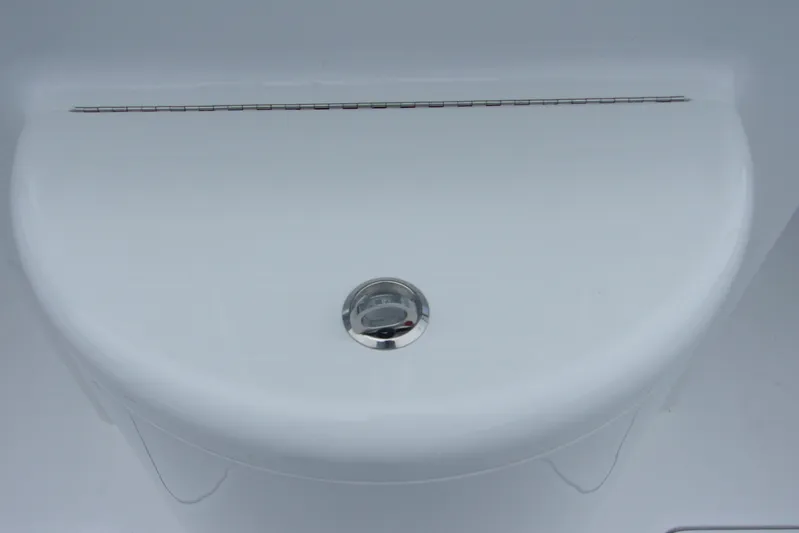  Yacht Photos Pics 2025 Bluewater 23 T boat deck with sleek white finish and chrome drain.