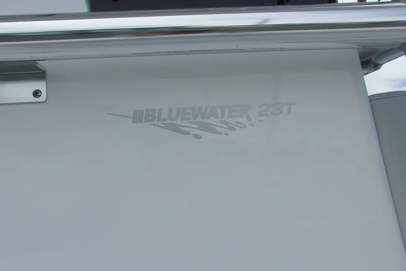  Yacht Photos Pics 2025 Bluewater 23 T boat logo on sleek white surface.