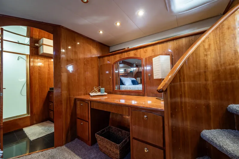 Kell Bell Yacht Photos Pics Luxurious 2001 Navigator Pilothouse interior with wooden cabinetry and elegant lighting.